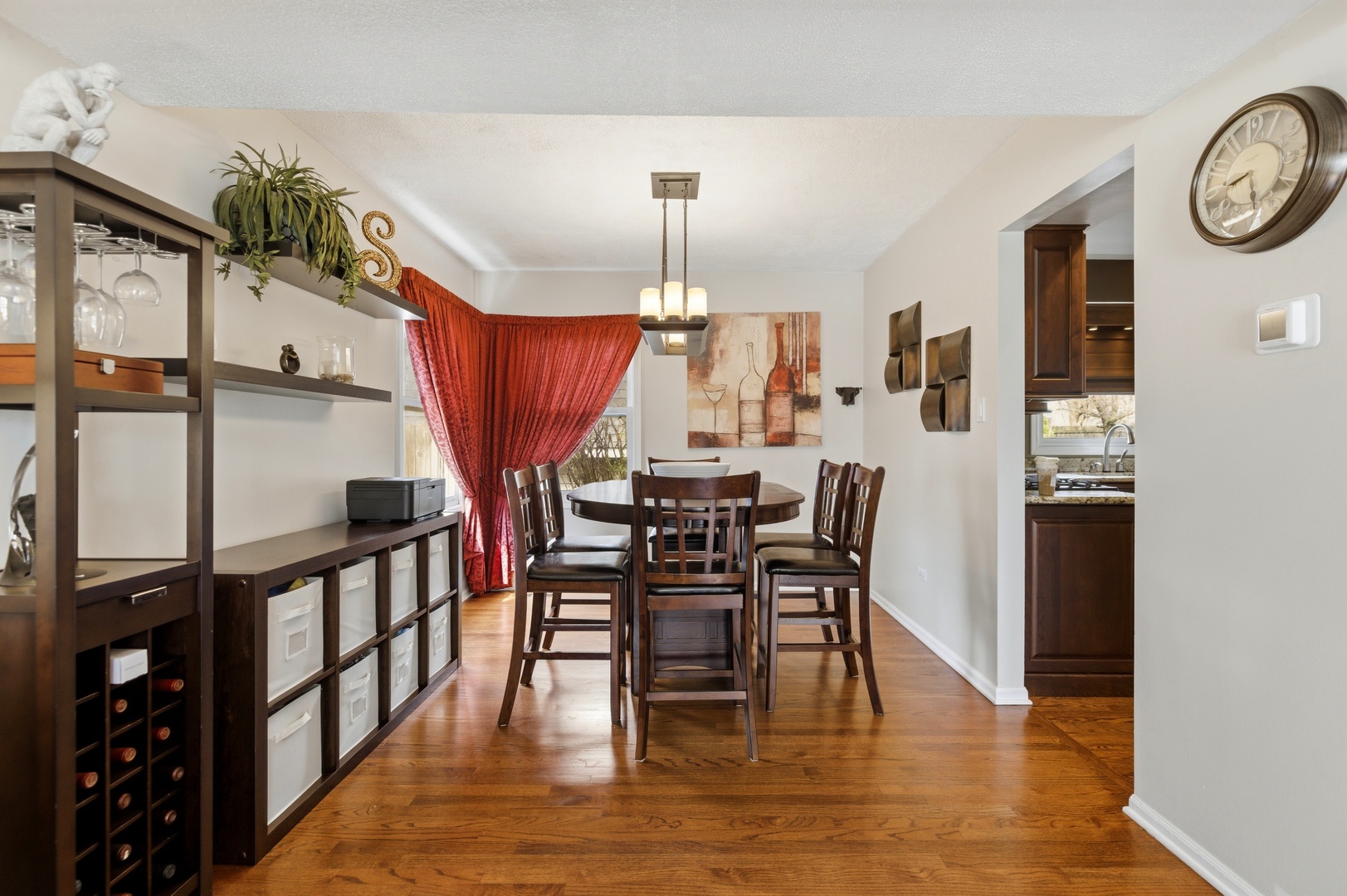 6900 Olde Gatehouse Road Tinley Park, IL 60477 - Photo 11 of 37 a dining room with furniture a chandelier and wooden floor