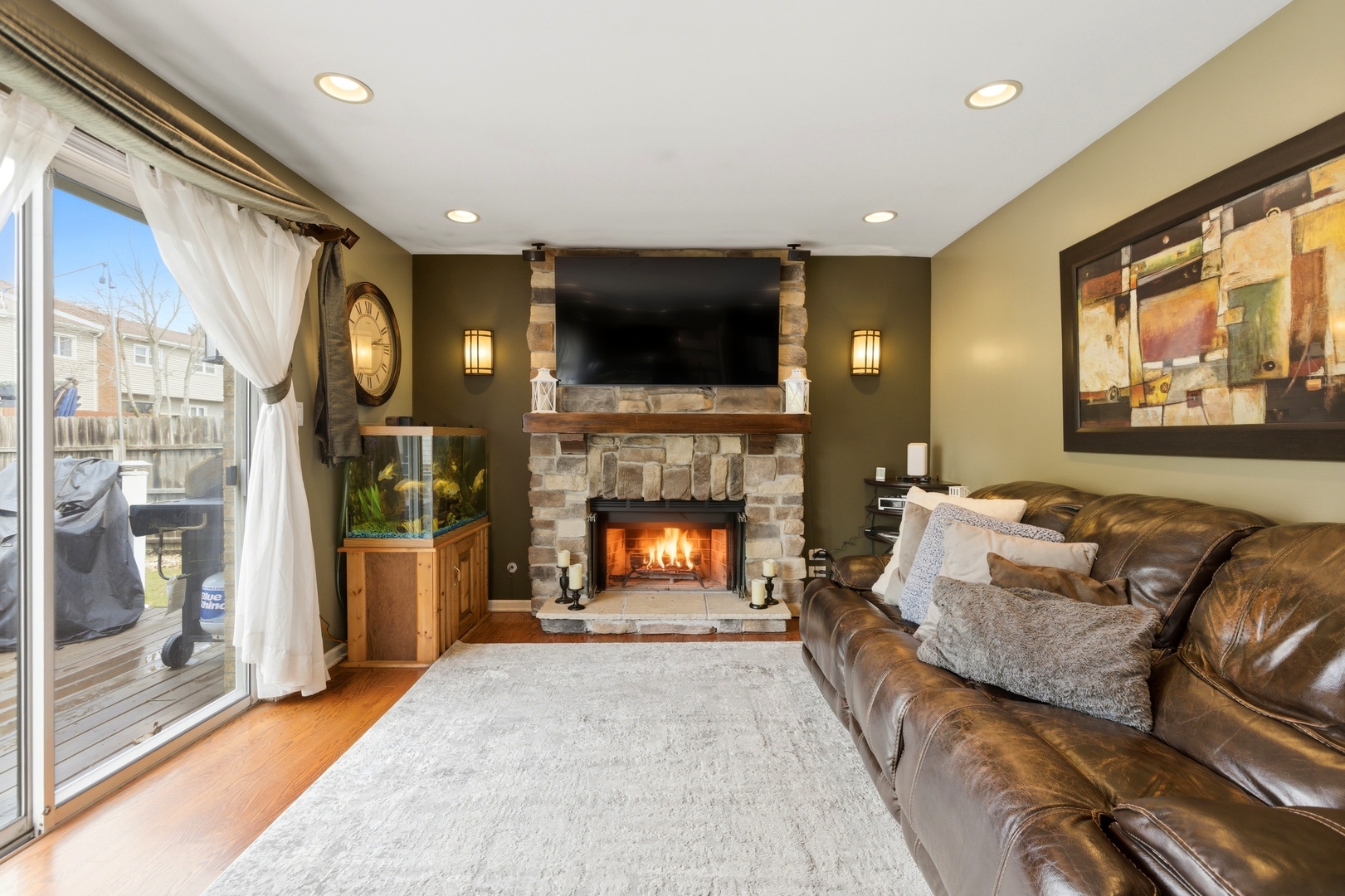 6900 Olde Gatehouse Road Tinley Park, IL 60477 - Photo 21 of 37 a living room with furniture and a fireplace