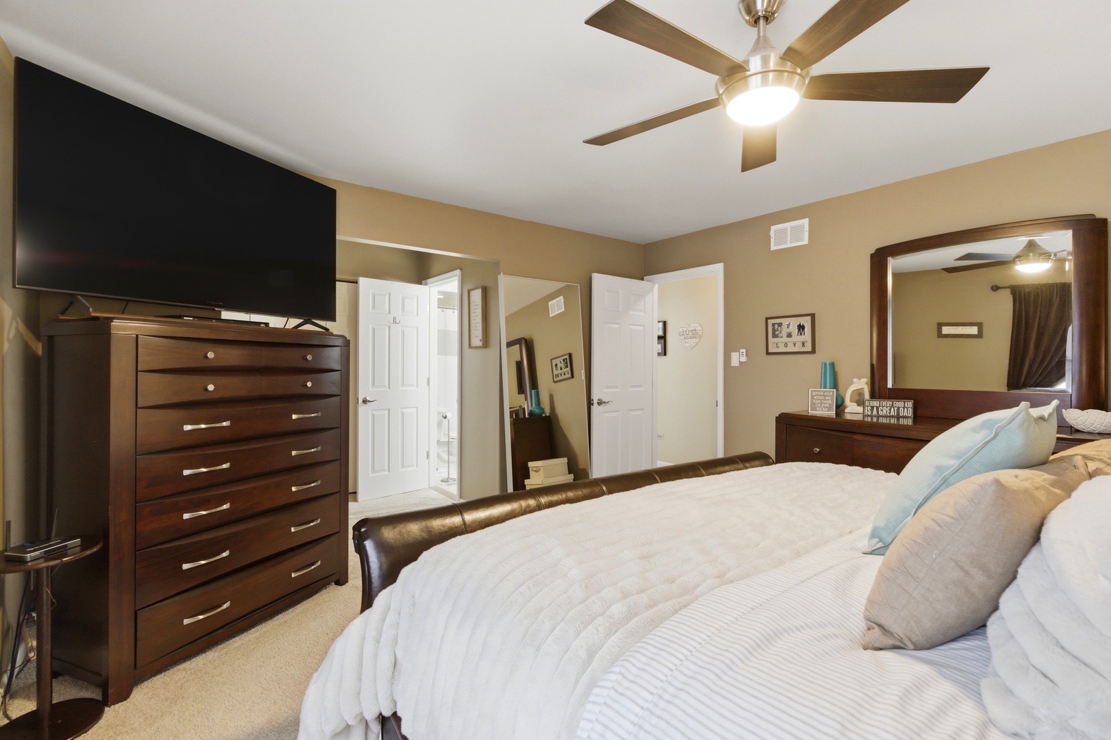 6900 Olde Gatehouse Road Tinley Park, IL 60477 - Photo 26 of 37 a bedroom with a bed and a chandelier