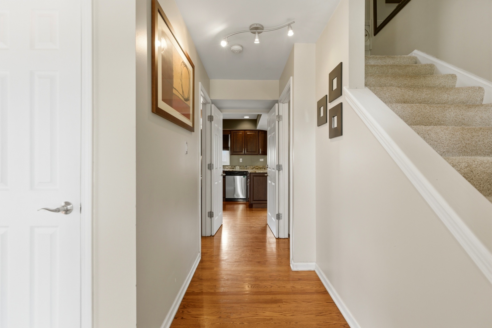 6900 Olde Gatehouse Road Tinley Park, IL 60477 - Photo 8 of 37 a view of a hallway with wooden floor and staircase