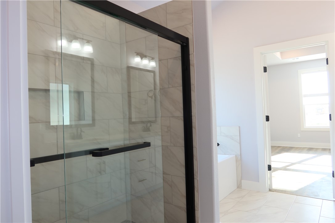 1971 Cambria Drive Bryan, TX 77807 - Photo 9 of 23 a bathroom with a glass shower door