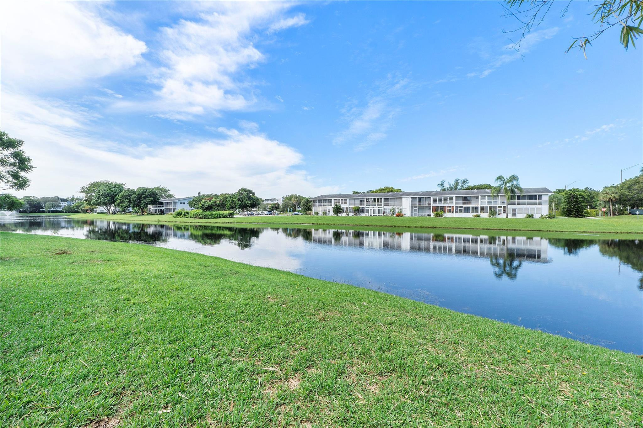 518 Durham, Unit 518 Deerfield Beach, FL 33442 - Photo 13 of 31 a view of a lake with houses in the back