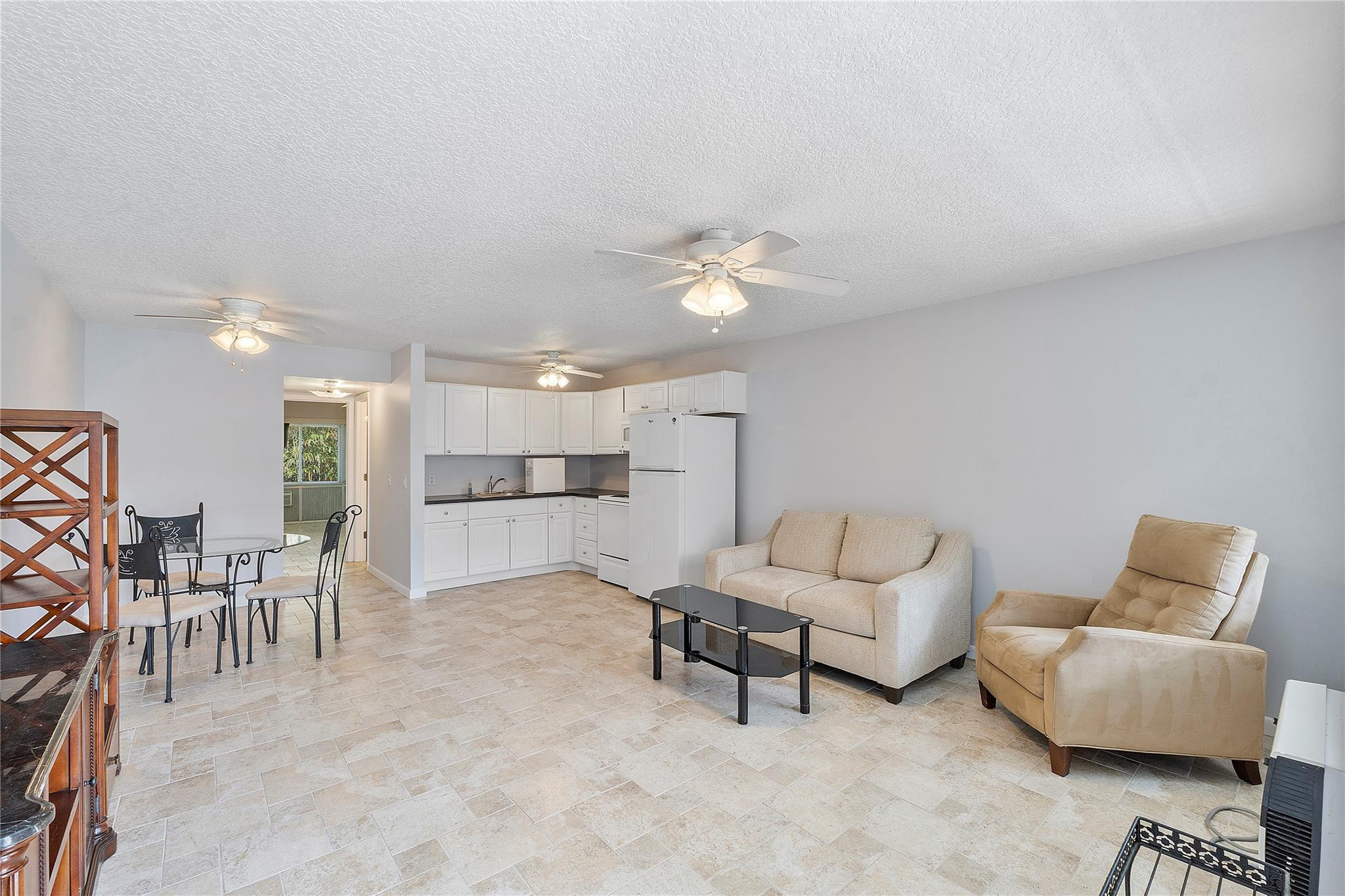 518 Durham, Unit 518 Deerfield Beach, FL 33442 - Photo 2 of 31 a living room with furniture and kitchen view