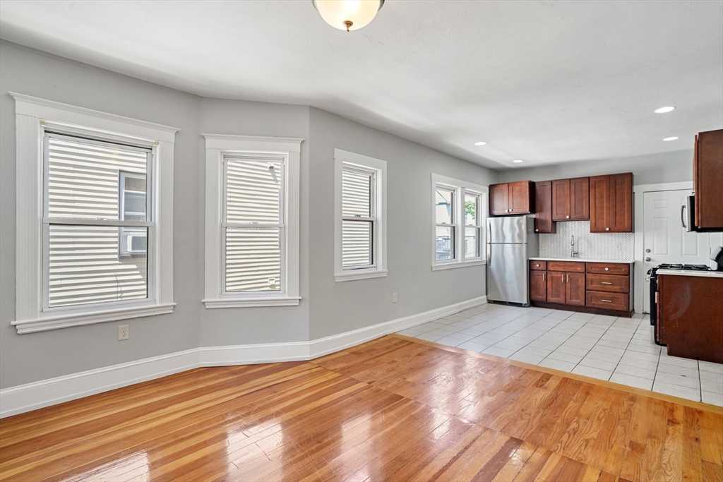 32 Millet Street, Unit 2 Boston, MA 02124 - Photo 4 of 14 a view of a kitchen with microwave and window