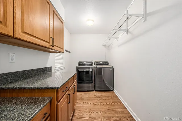 a kitchen with stainless steel appliances granite countertop a stove a sink and dishwasher