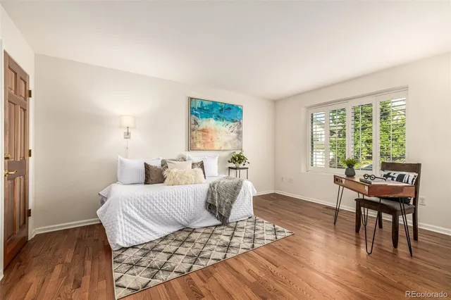 a bedroom with a bed and a table in it