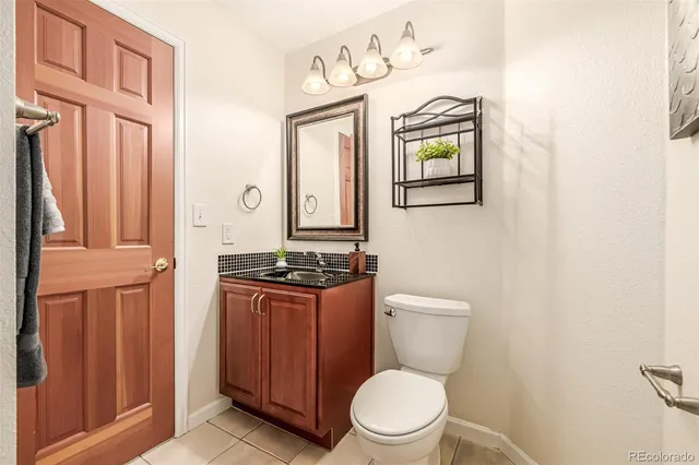 a white toilet sitting next to a bathroom sink