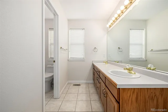 a bathroom with a sink a vanity and a mirror