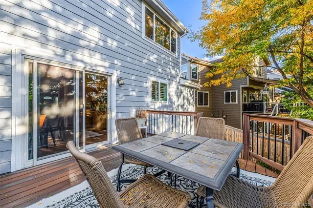 a view of a patio with a table and chairs