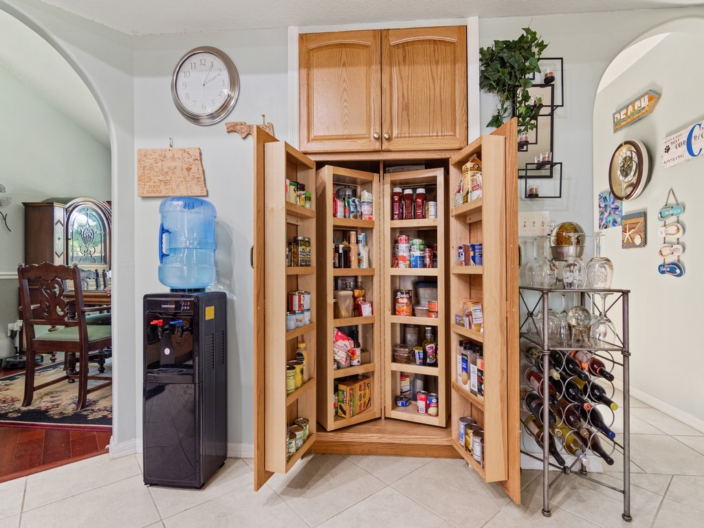 5302 Seminole Road Fort Pierce, FL 34951 - Photo 13 of 36 a view of walk in closet with clothes and shoes
