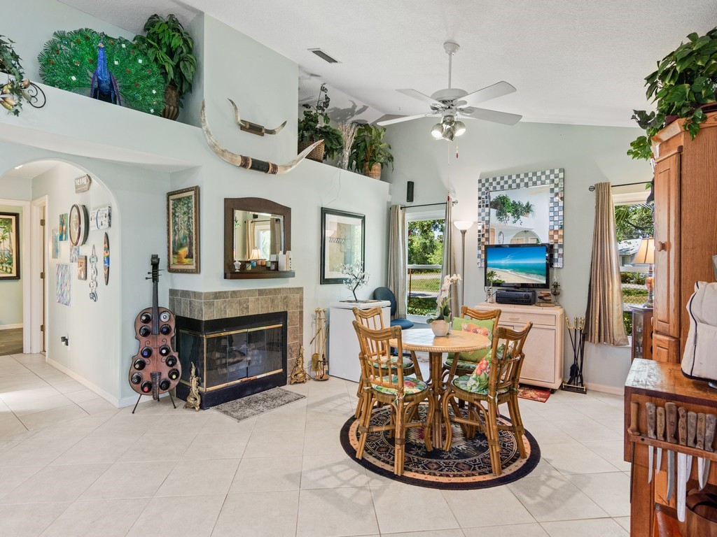 5302 Seminole Road Fort Pierce, FL 34951 - Photo 14 of 36 a view of a livingroom with furniture and a fireplace
