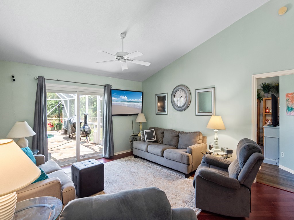 5302 Seminole Road Fort Pierce, FL 34951 - Photo 15 of 36 a living room with furniture a large window and a table