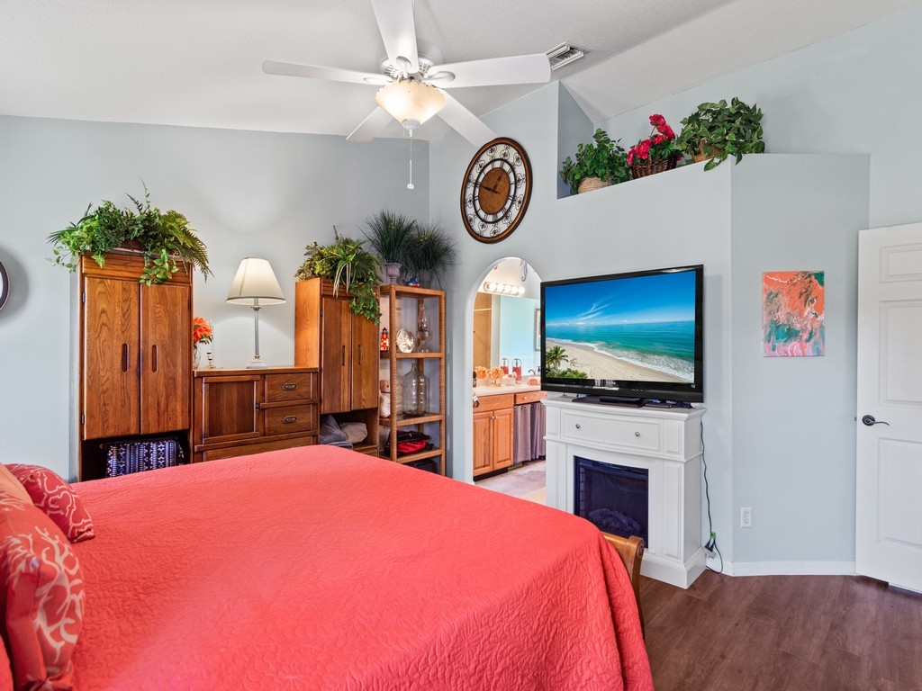 5302 Seminole Road Fort Pierce, FL 34951 - Photo 17 of 36 a bedroom with a bed and a flat screen tv
