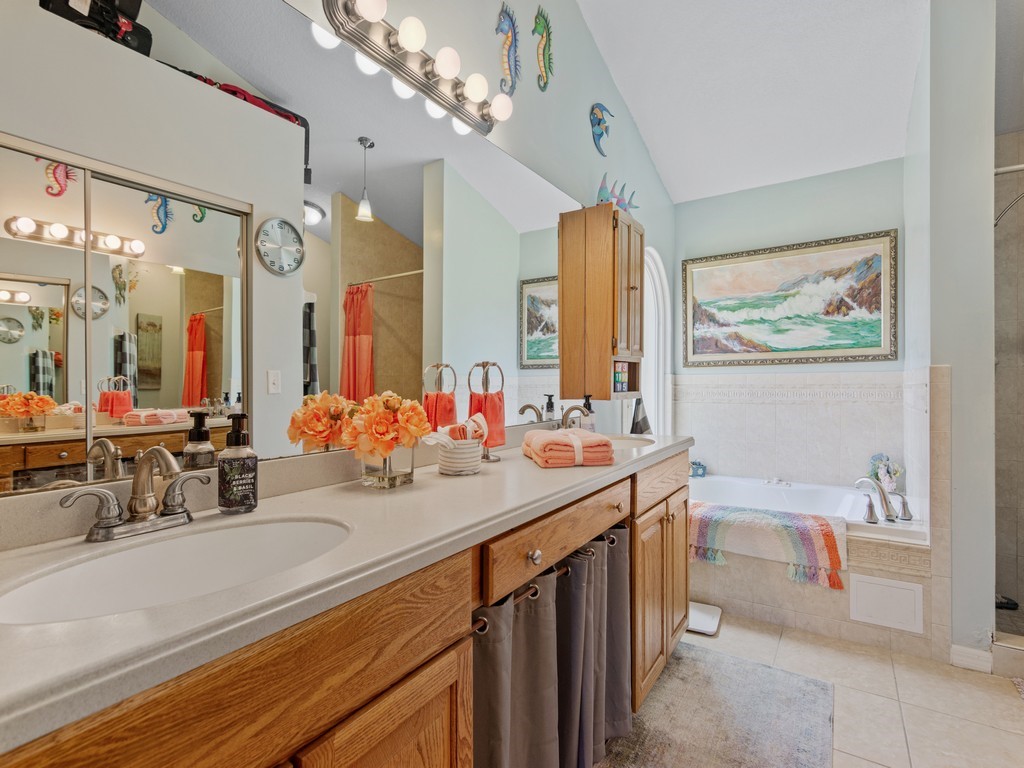 5302 Seminole Road Fort Pierce, FL 34951 - Photo 18 of 36 a bathroom with a sink double vanity granite and a large mirror