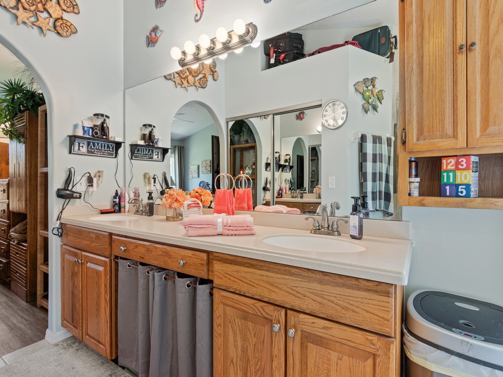 5302 Seminole Road Fort Pierce, FL 34951 - Photo 19 of 36 a bathroom with a sink double vanity and a mirror