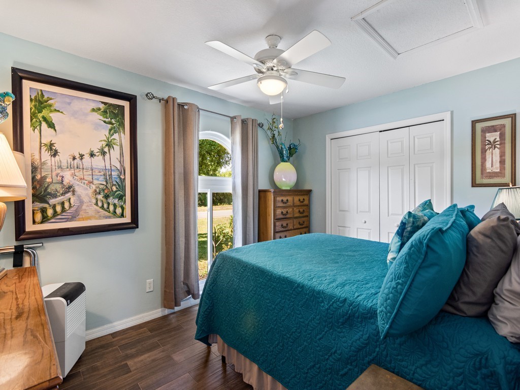 5302 Seminole Road Fort Pierce, FL 34951 - Photo 22 of 36 a bedroom with a bed and window