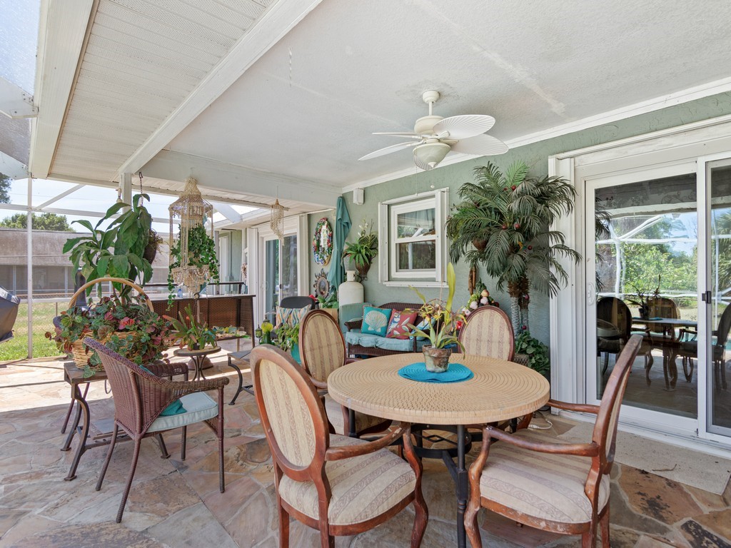 5302 Seminole Road Fort Pierce, FL 34951 - Photo 23 of 36 a outdoor dining space with furniture and window