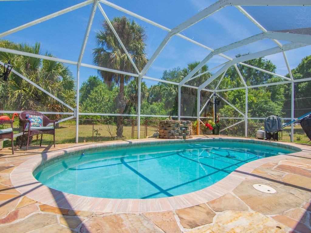 5302 Seminole Road Fort Pierce, FL 34951 - Photo 25 of 36 a view of a backyard with sitting area