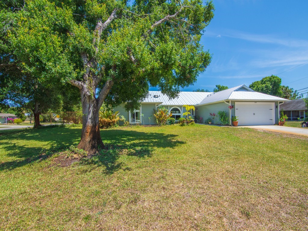 5302 Seminole Road Fort Pierce, FL 34951 - Photo 3 of 36 a front view of house with yard and green space