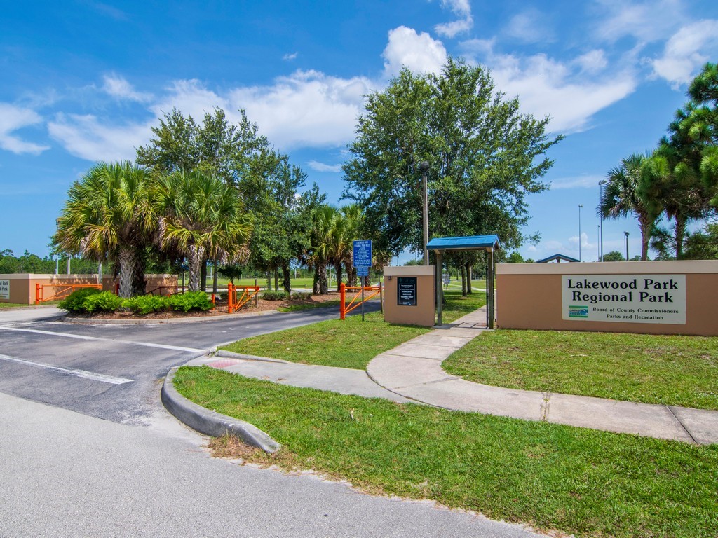 5302 Seminole Road Fort Pierce, FL 34951 - Photo 32 of 36 a front view of a house with a yard