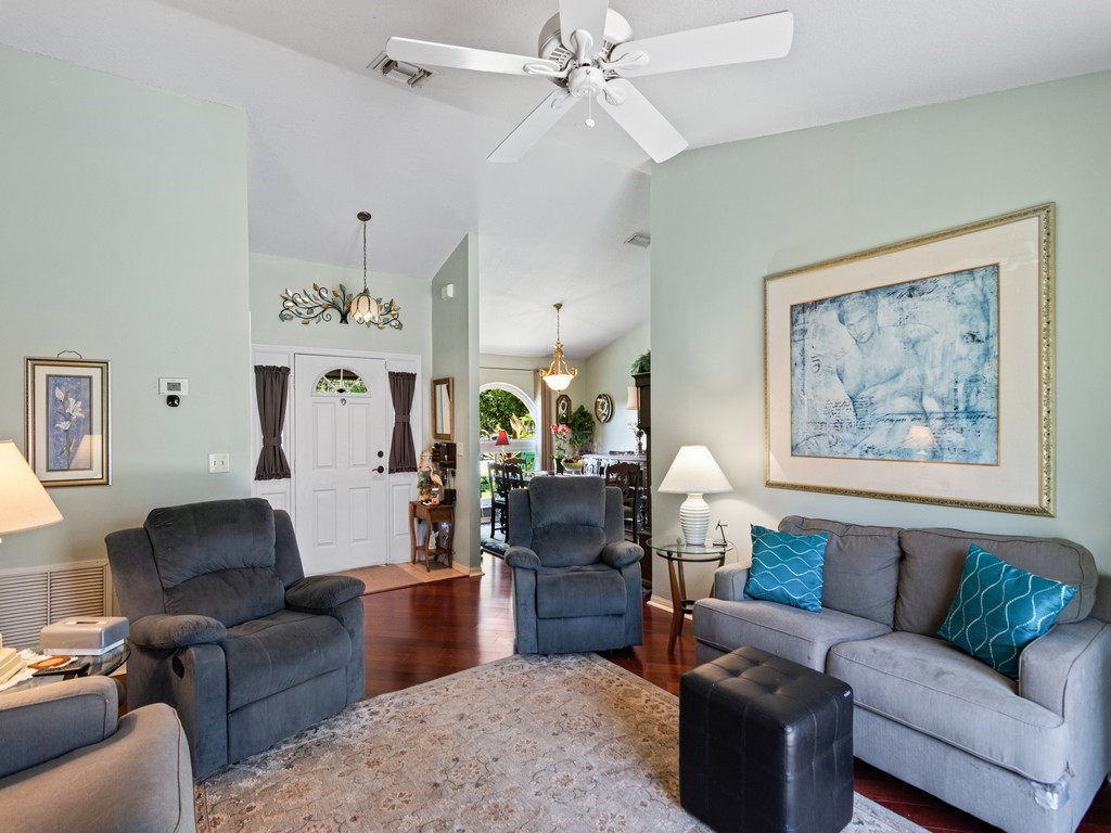 5302 Seminole Road Fort Pierce, FL 34951 - Photo 7 of 36 a living room with furniture and a chandelier