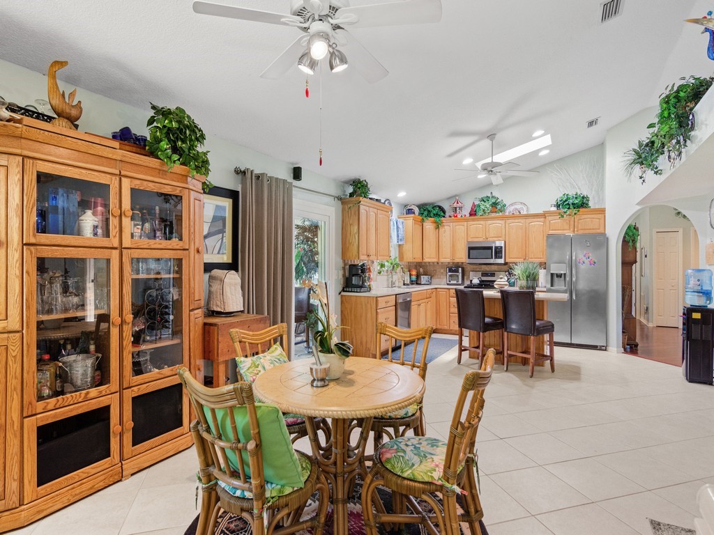 5302 Seminole Road Fort Pierce, FL 34951 - Photo 9 of 36 a view of a dining room with furniture