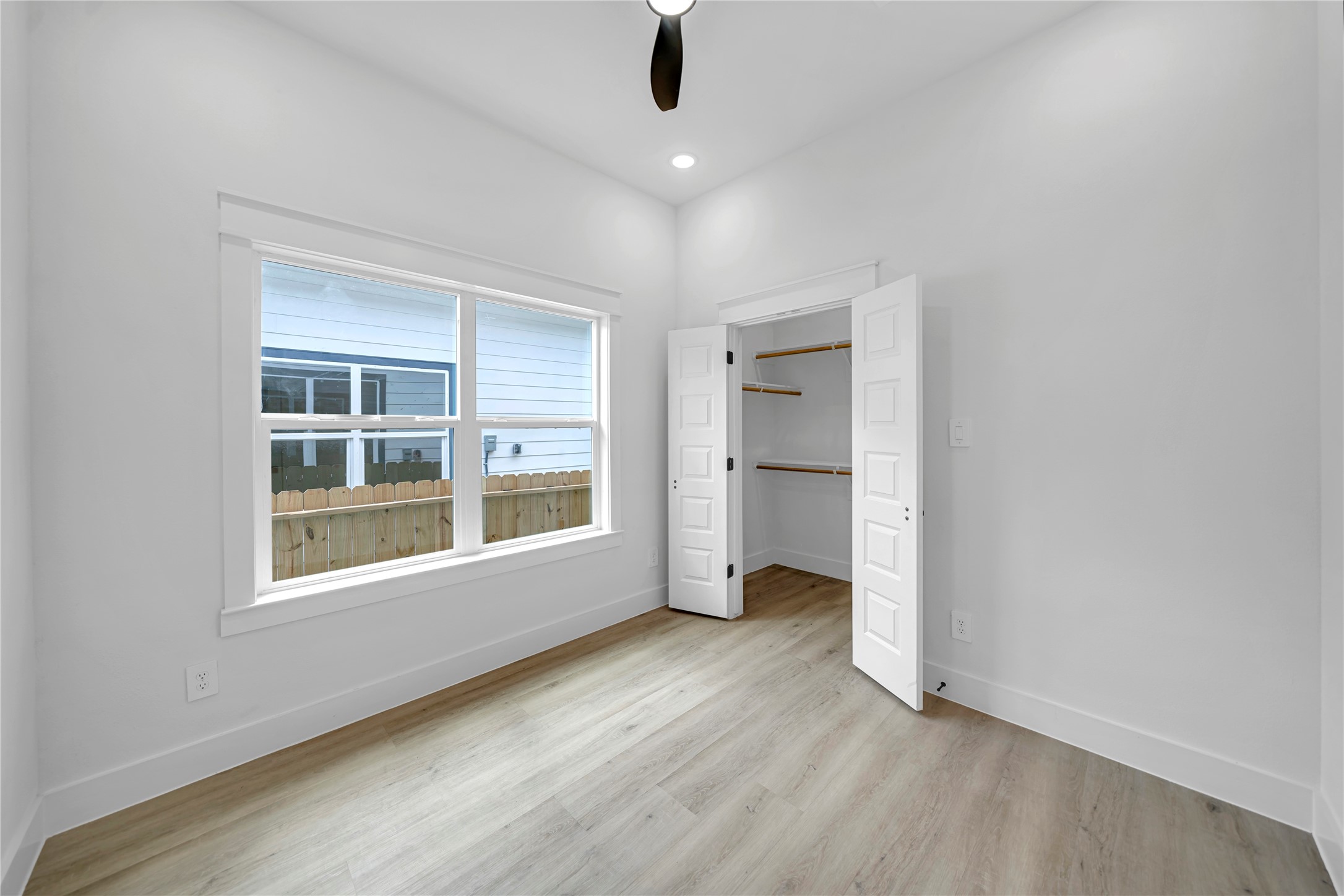 4834 Higgins Street, Unit B Houston, TX 77033 - Photo 24 of 34 an empty room with cabinet and windows