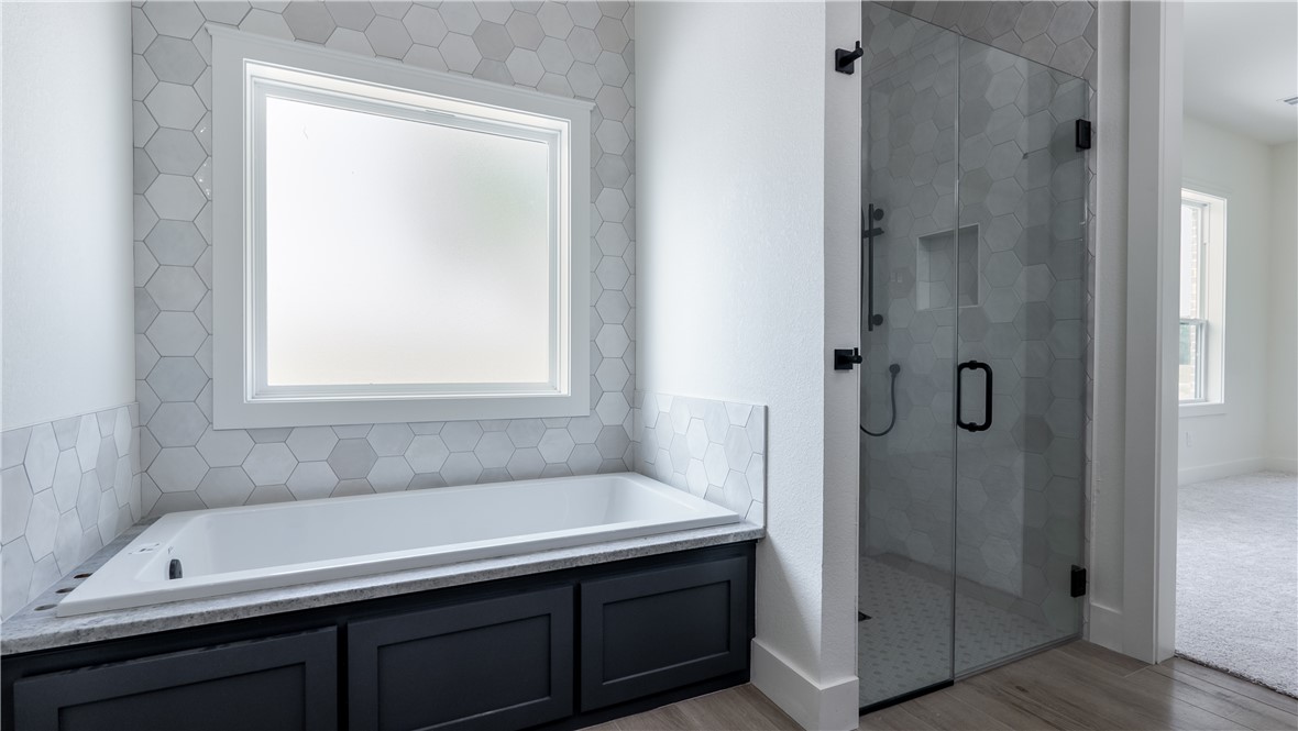 10017 Panther Creek Road Iola, TX 77861 - Photo 20 of 32 a bathroom with a shower and a sink