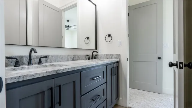 a bathroom with a shower and a sink