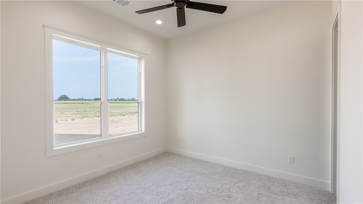 10017 Panther Creek Road Iola, TX 77861 - Photo 23 of 32 an empty room with a window