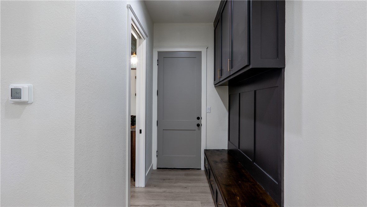 10017 Panther Creek Road Iola, TX 77861 - Photo 28 of 32 a view of a hallway with wooden floor
