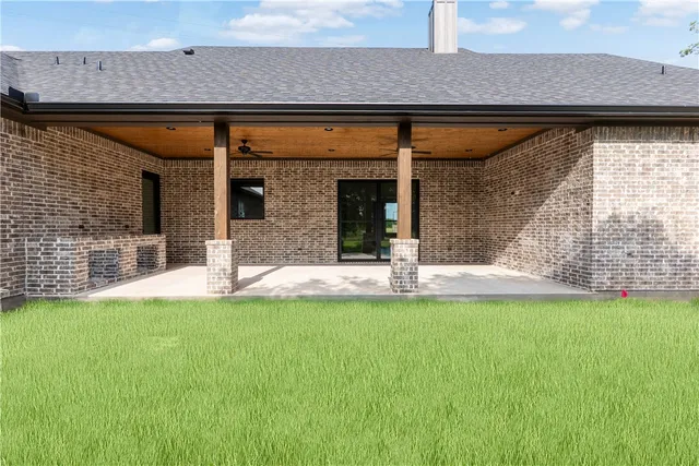 a view of a backyard with a garden and plants