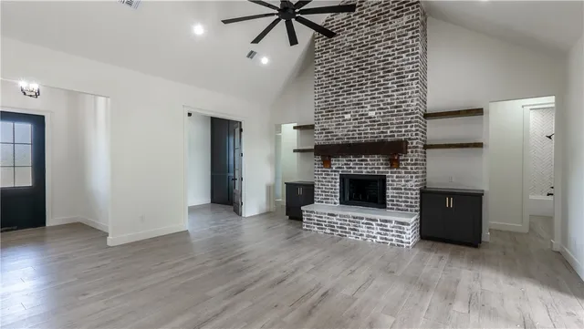 a brick oven with a fireplace in it