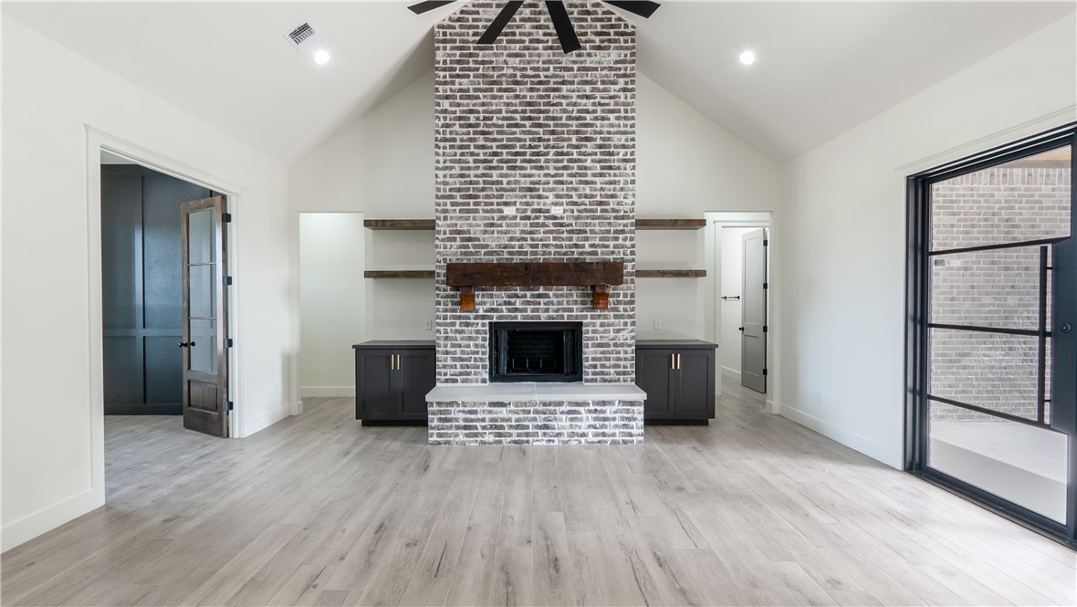 10017 Panther Creek Road Iola, TX 77861 - Photo 8 of 32 a living room with a fireplace