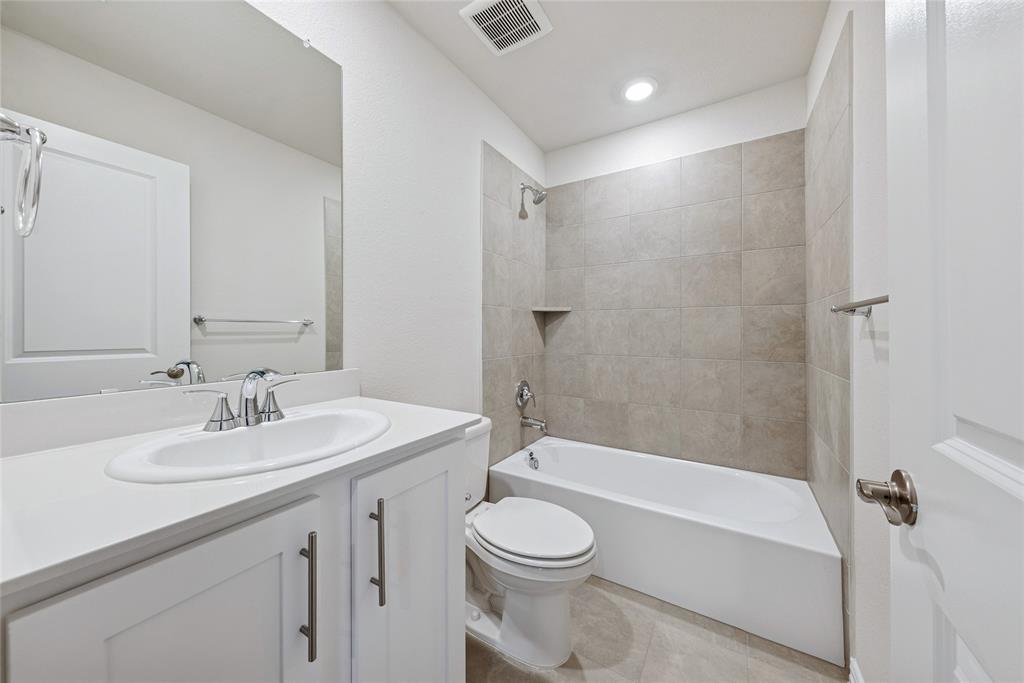 2221 Horseshoe Lane Seagoville, TX 75159 - Photo 18 of 21 a bathroom with a sink a toilet and shower