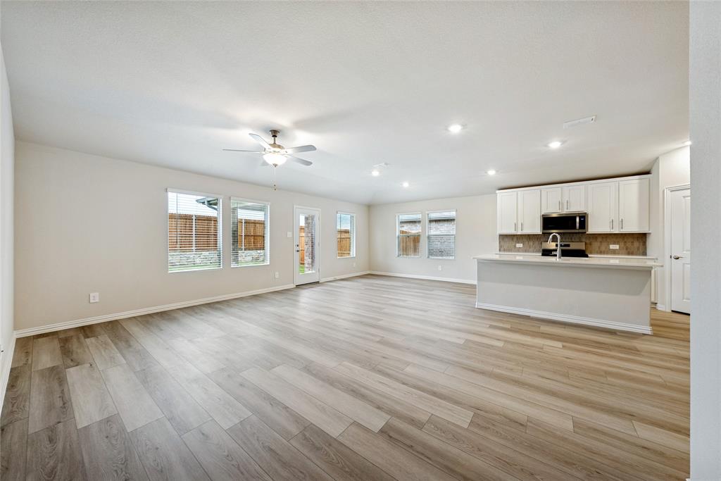 2221 Horseshoe Lane Seagoville, TX 75159 - Photo 3 of 21 a view of a kitchen with a sink and a large window