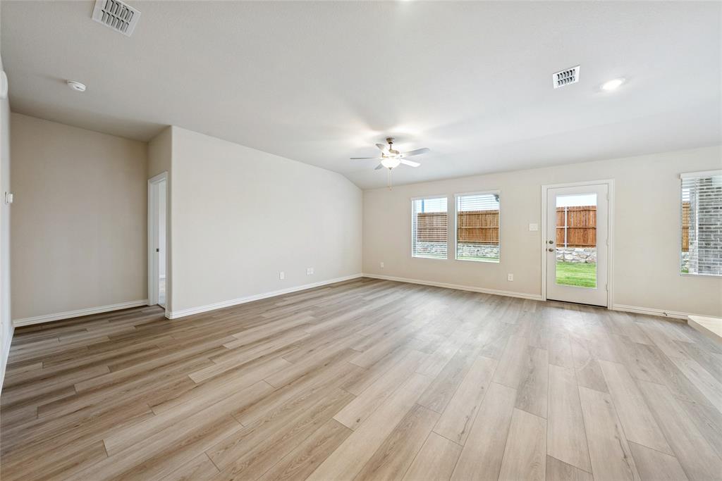 2221 Horseshoe Lane Seagoville, TX 75159 - Photo 6 of 21 a view of an empty room with wooden floor and a window