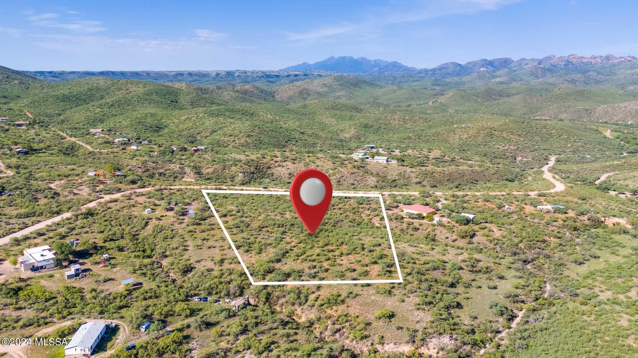 15475 East Hillton Ranch Road Vail, AZ 85641 - Photo 6 of 15 a aerial view of a house with a backyard space and mountain view in back