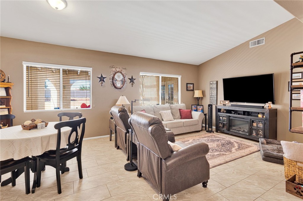 20403 Ochoa Road Apple Valley, CA 92307 - Photo 14 of 48 a living room with furniture and a flat screen tv
