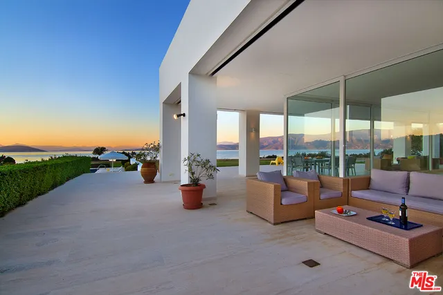 a view of a garden with a building in the background