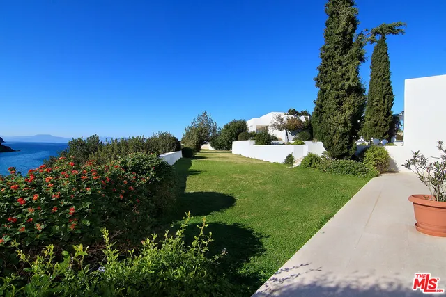 a view of a porch with a potted plant
