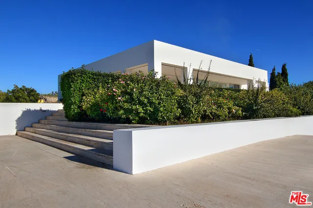 a view of swimming pool with lounge chair