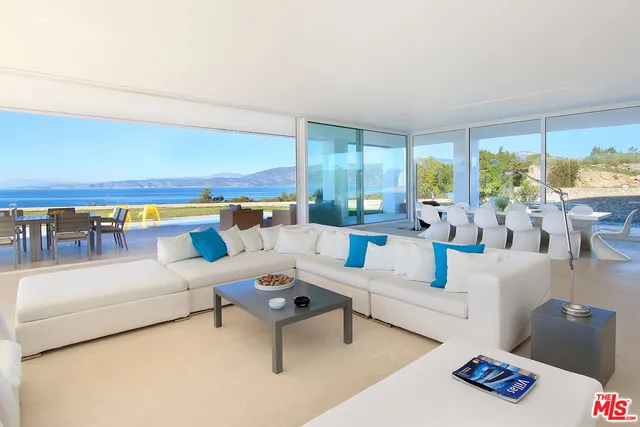 a kitchen that has a sink and a stove