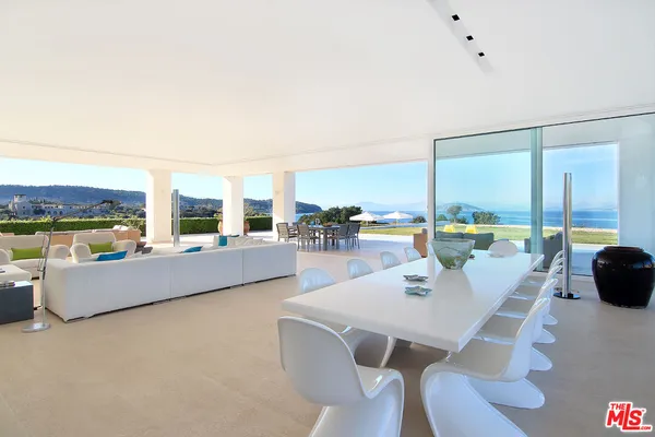 a kitchen with cabinets and white appliances