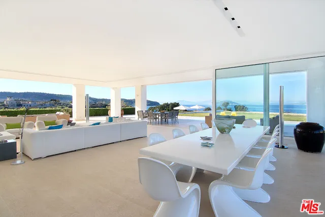 a kitchen with cabinets and white appliances
