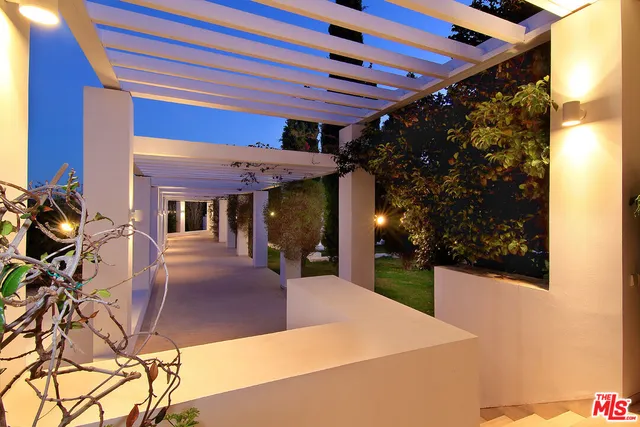 a view of swimming pool with an outdoor seating