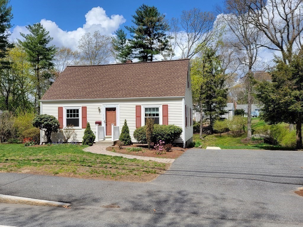 719 Potter Road Framingham, MA 01701 - Photo 32 of 34 a front view of a house with a yard and outdoor seating