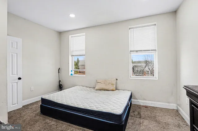 a room with a bed and a window