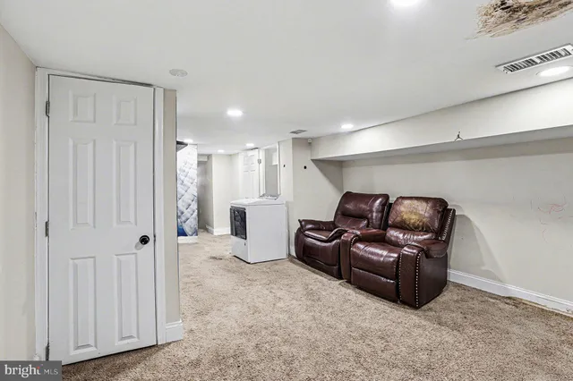 a view of a storage & utility room with a sink