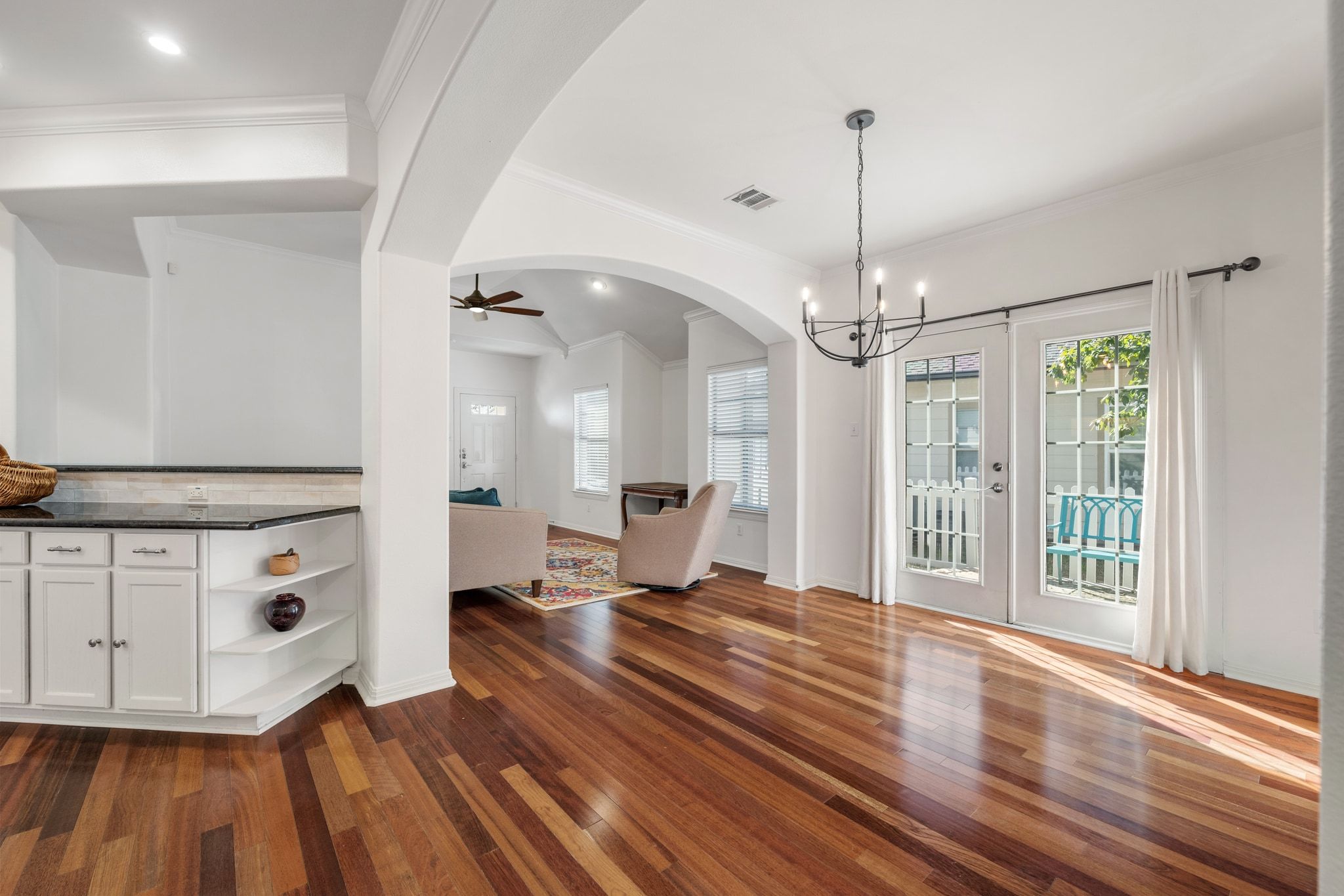 6801 Beckett Road, Unit 134L Austin, TX 78749 - Photo 11 of 30 a living room with hard wood floors and a ceiling fan